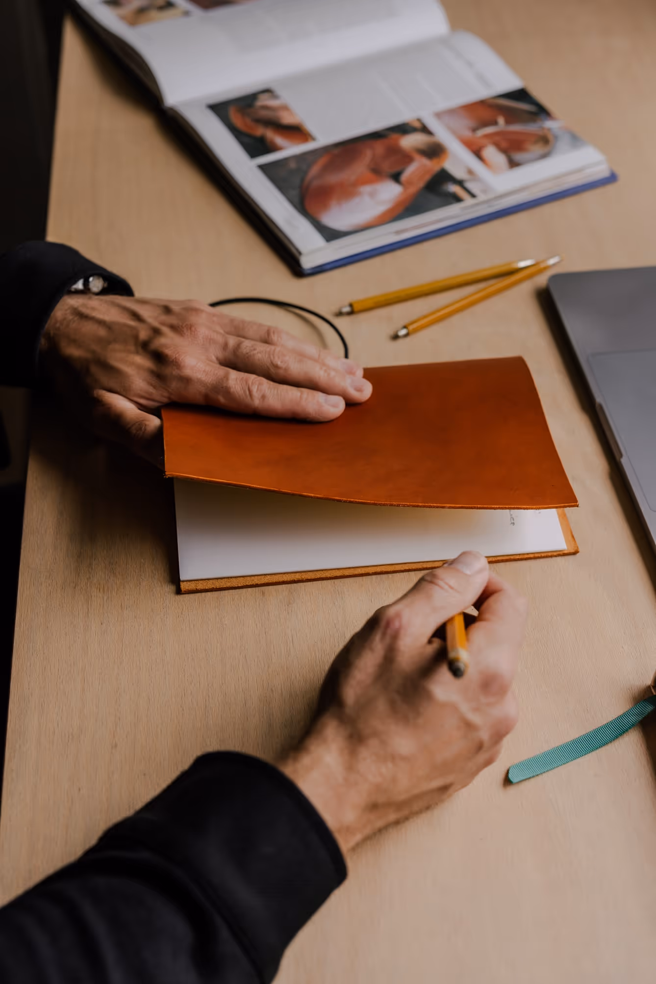 A person is writing on a piece of paper.