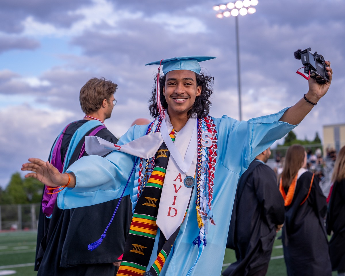 At his commencement, Mason is always ready to capture the moment