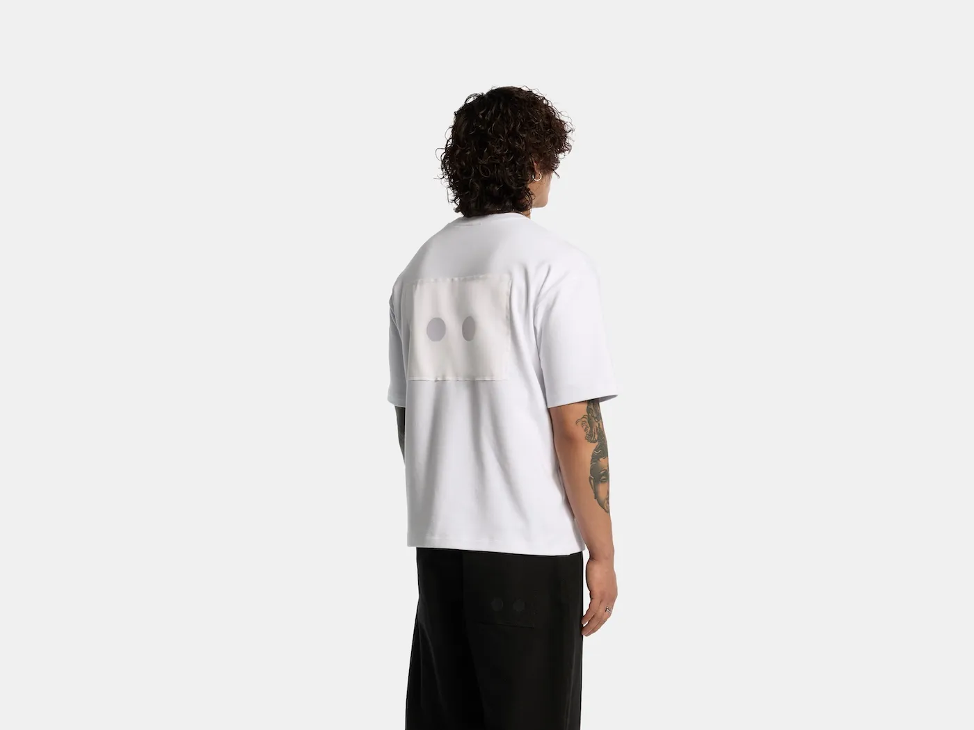 Back of the white Odd Uniform T-shirt with the eyes patch
