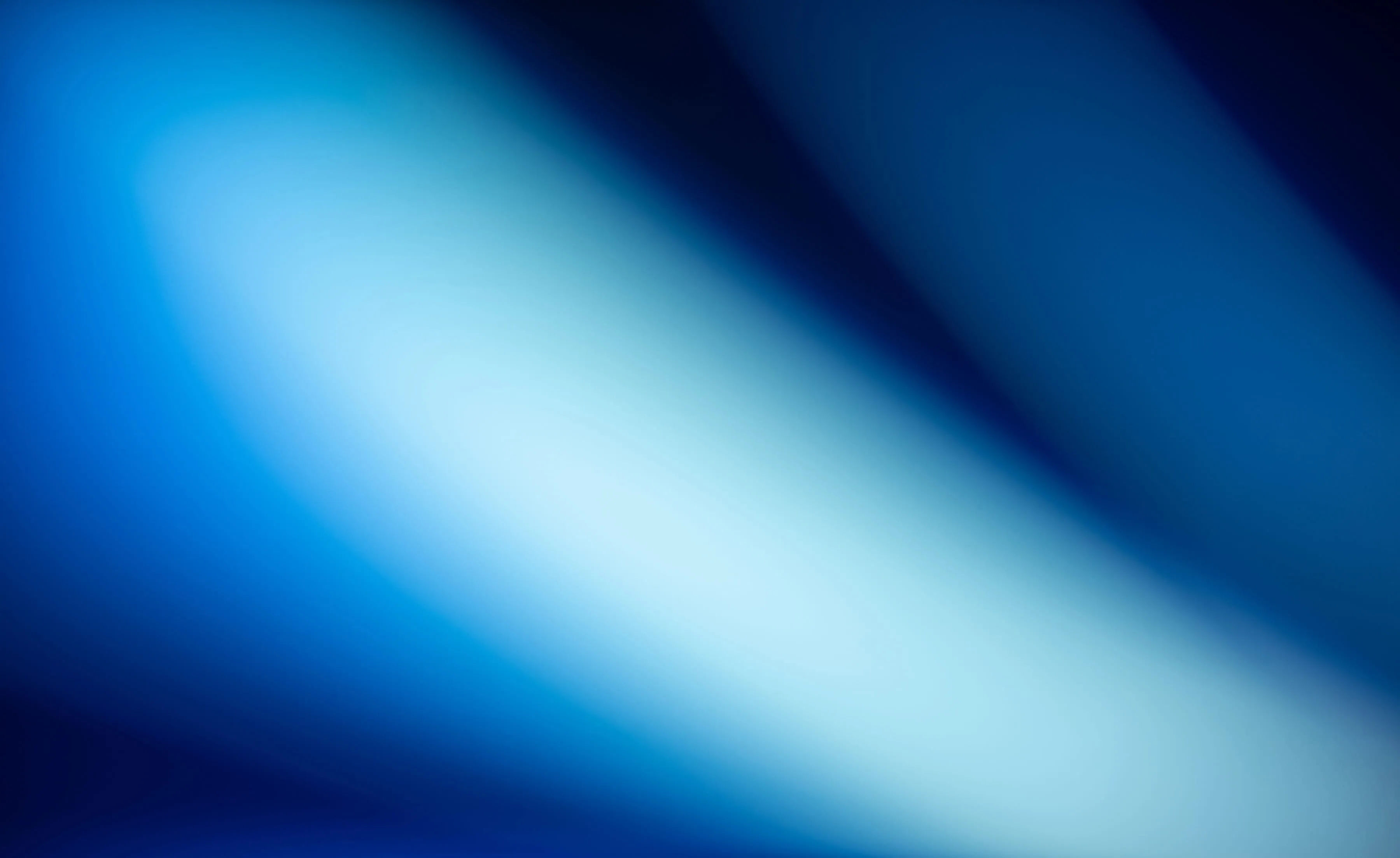 Abstract gradient background with smooth blue and white light blending diagonally.