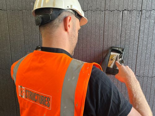 ICF structure worker doing a quality check