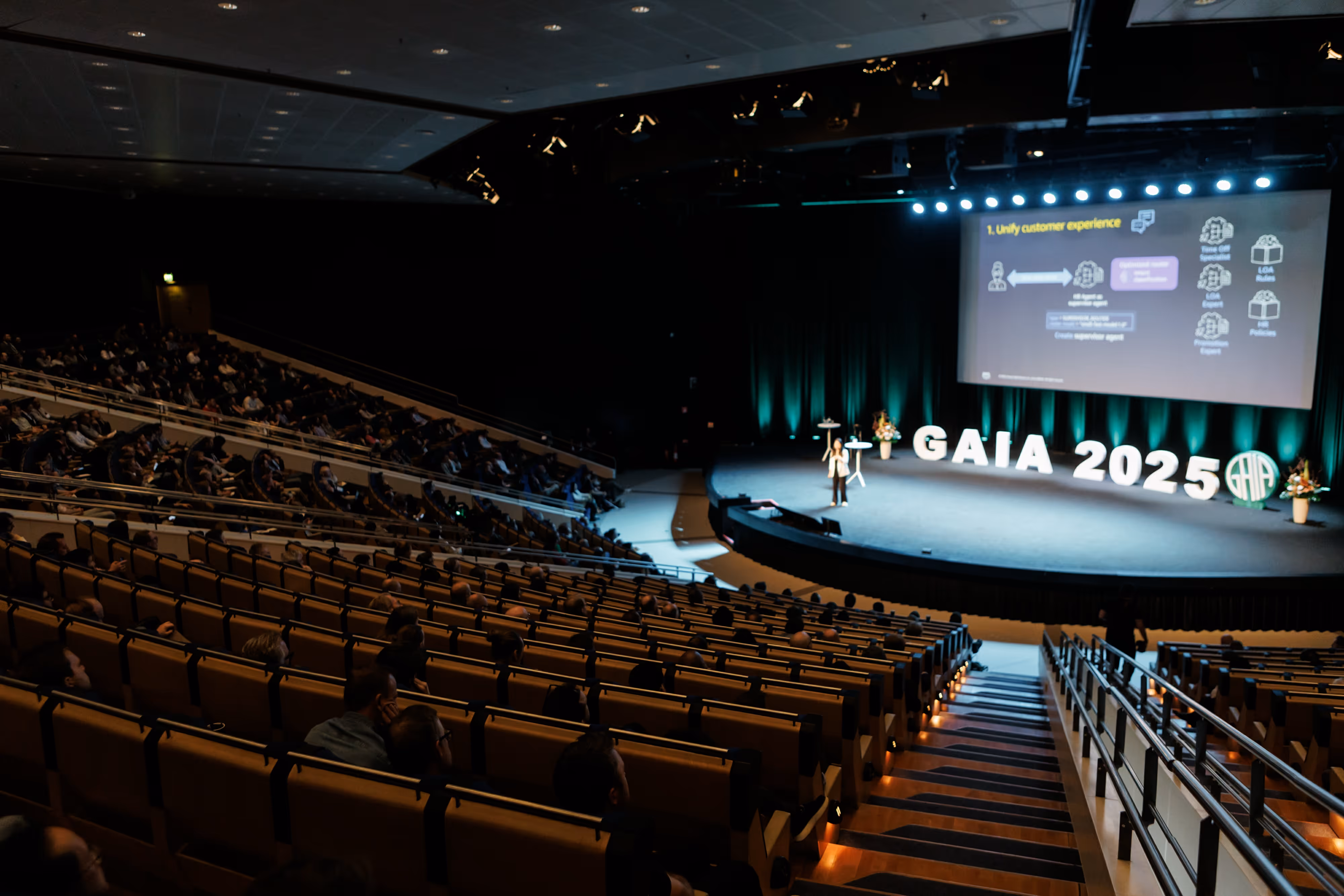 A photo showing a speaker in front of the audience in the Congress Hall at the 2025 GAIA Conference. Photo by Anton Kozyr.