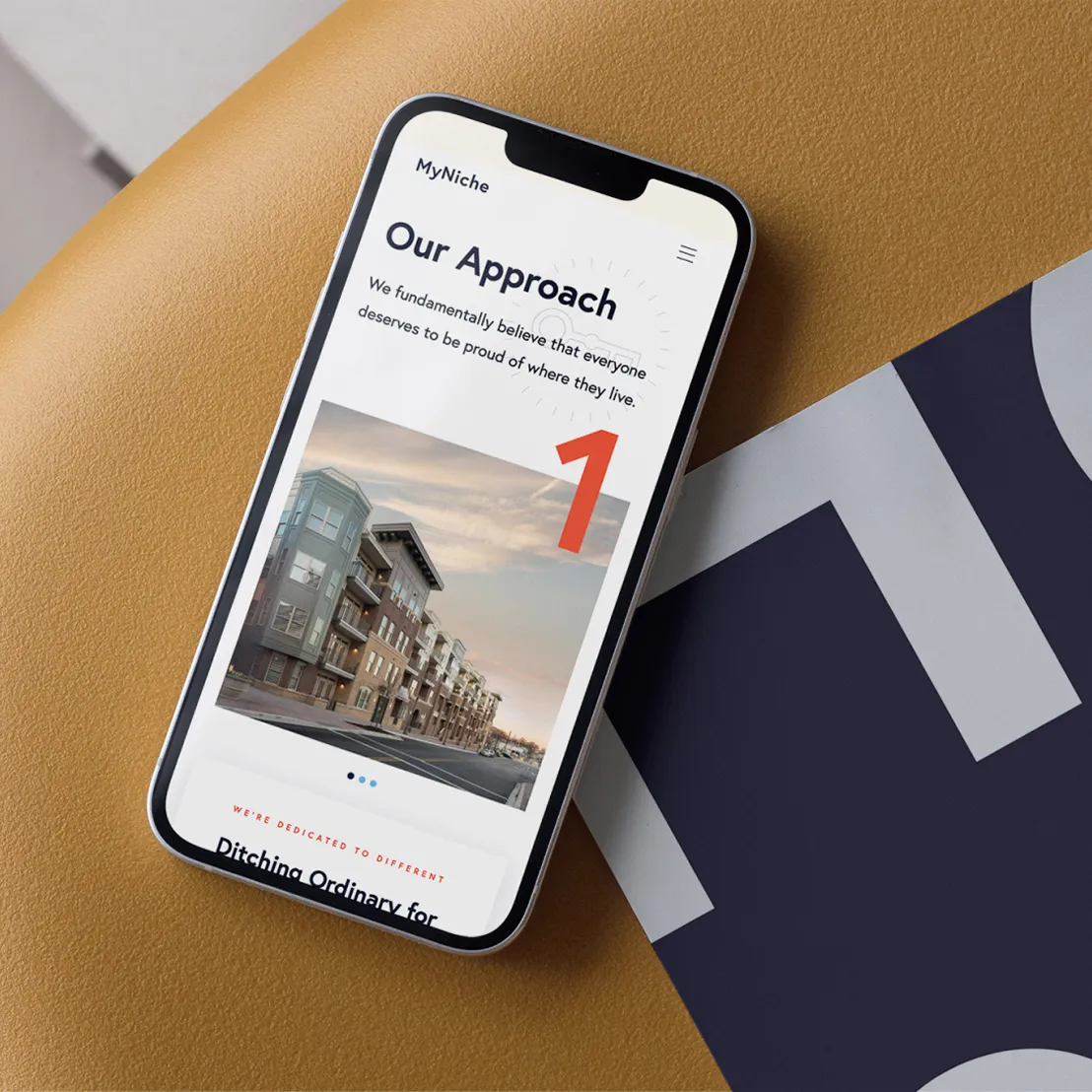 Smartphone displaying MyNiche's website on a page titled 'Our Approach'