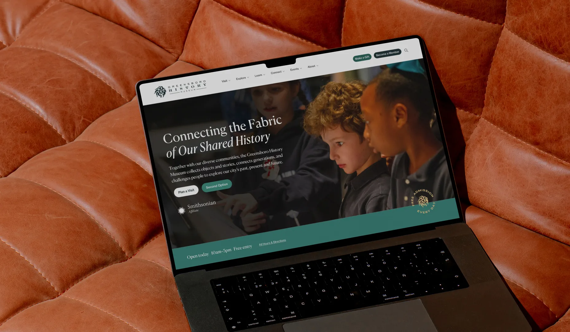 Greensboro History Museum home page on a laptop