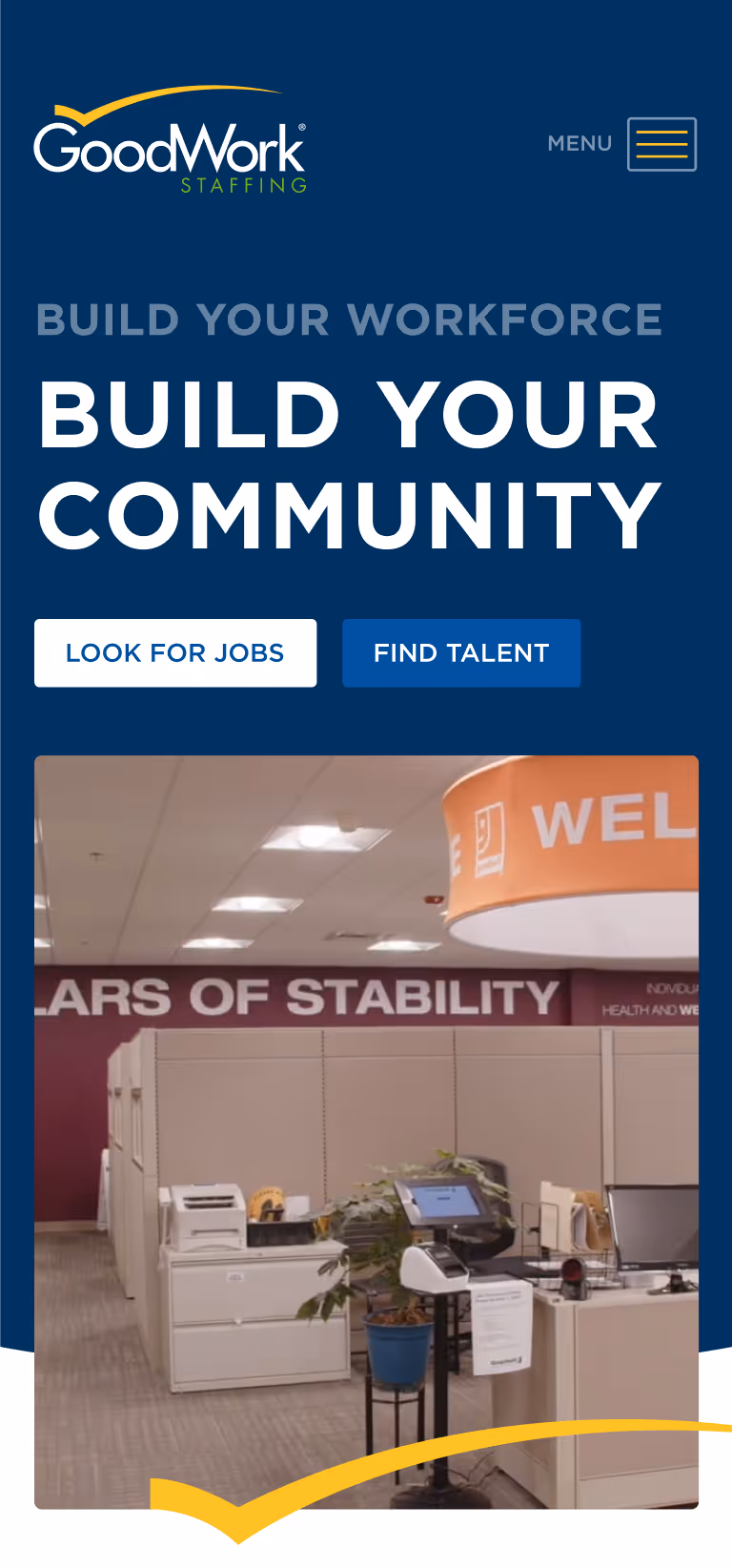 GoodWork Staffing website header with slogan Build Your Workforce Build Your Community and buttons Look for Jobs and Find Talent, above an office cubicle workspace photo.