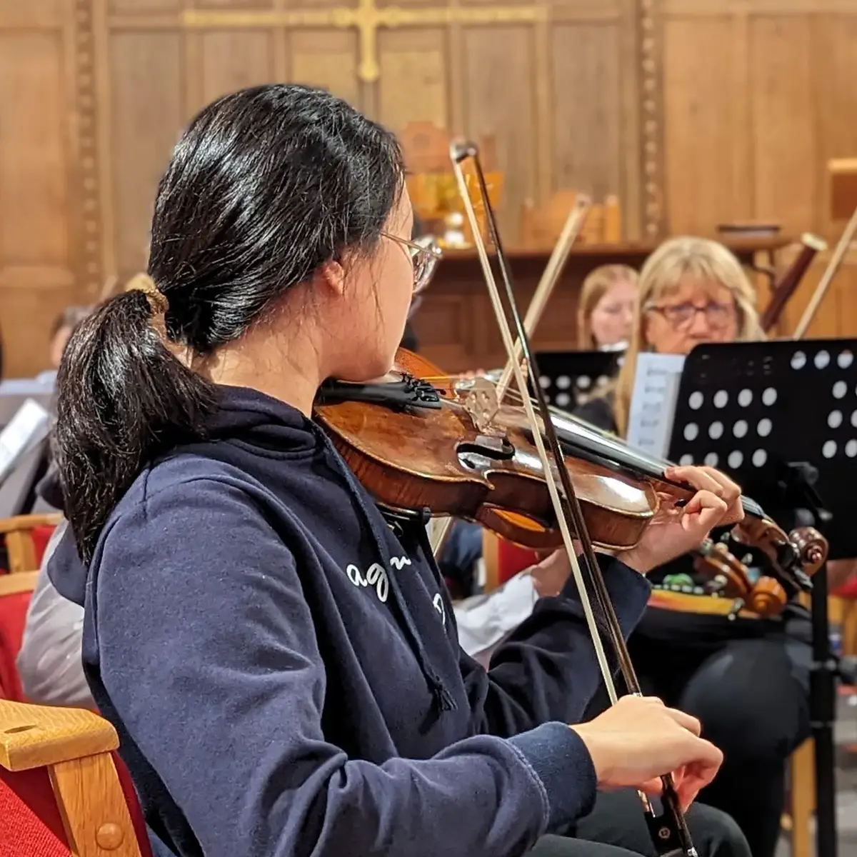 Playing violin in concert