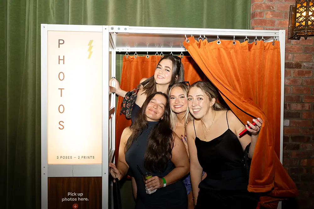 4 girls at a photo booth party