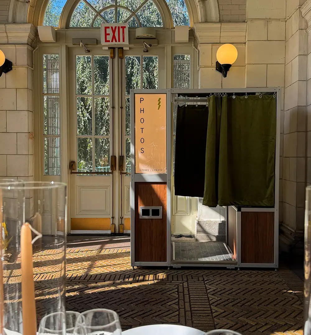 a corporate event with an enclosed photo booth