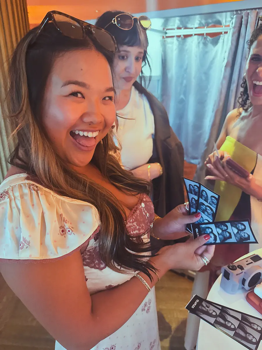 A girl looking at a brand activation photo strip