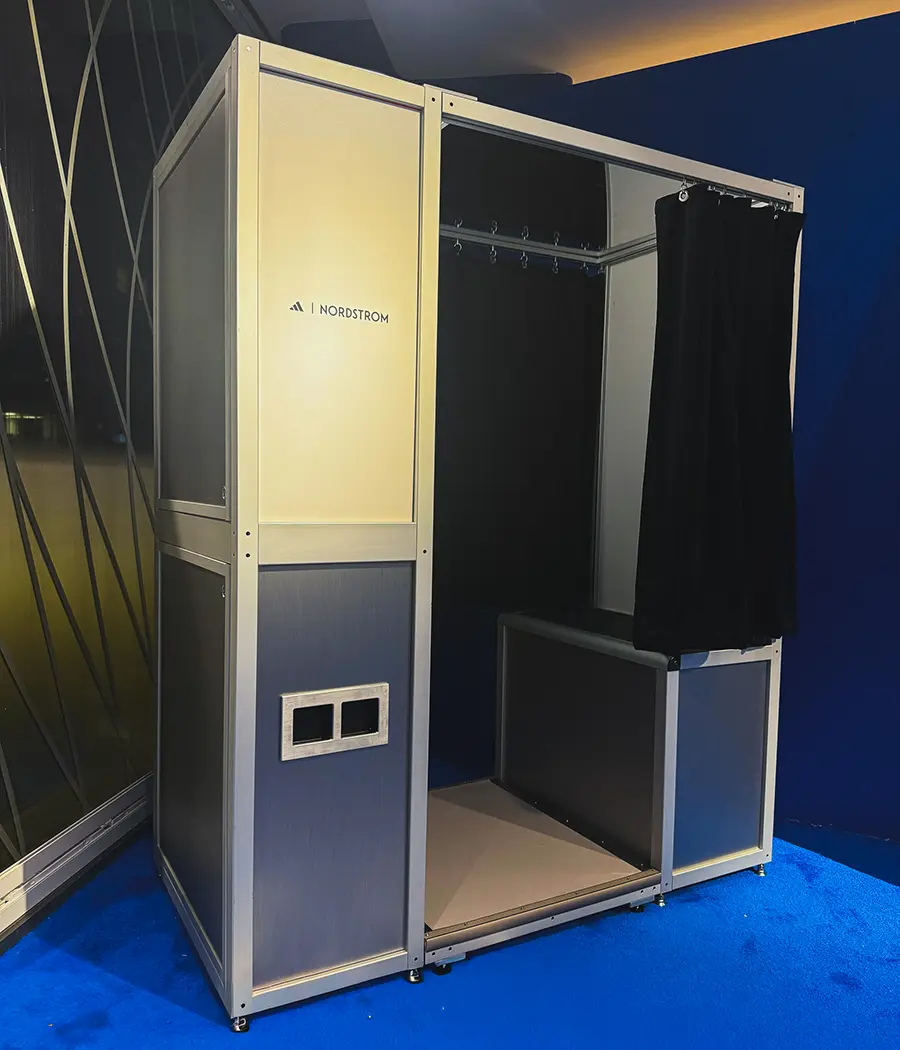 Minimalist Adidas x Nordstrom photo booth with backlit sign on blue carpet for World Cup activation