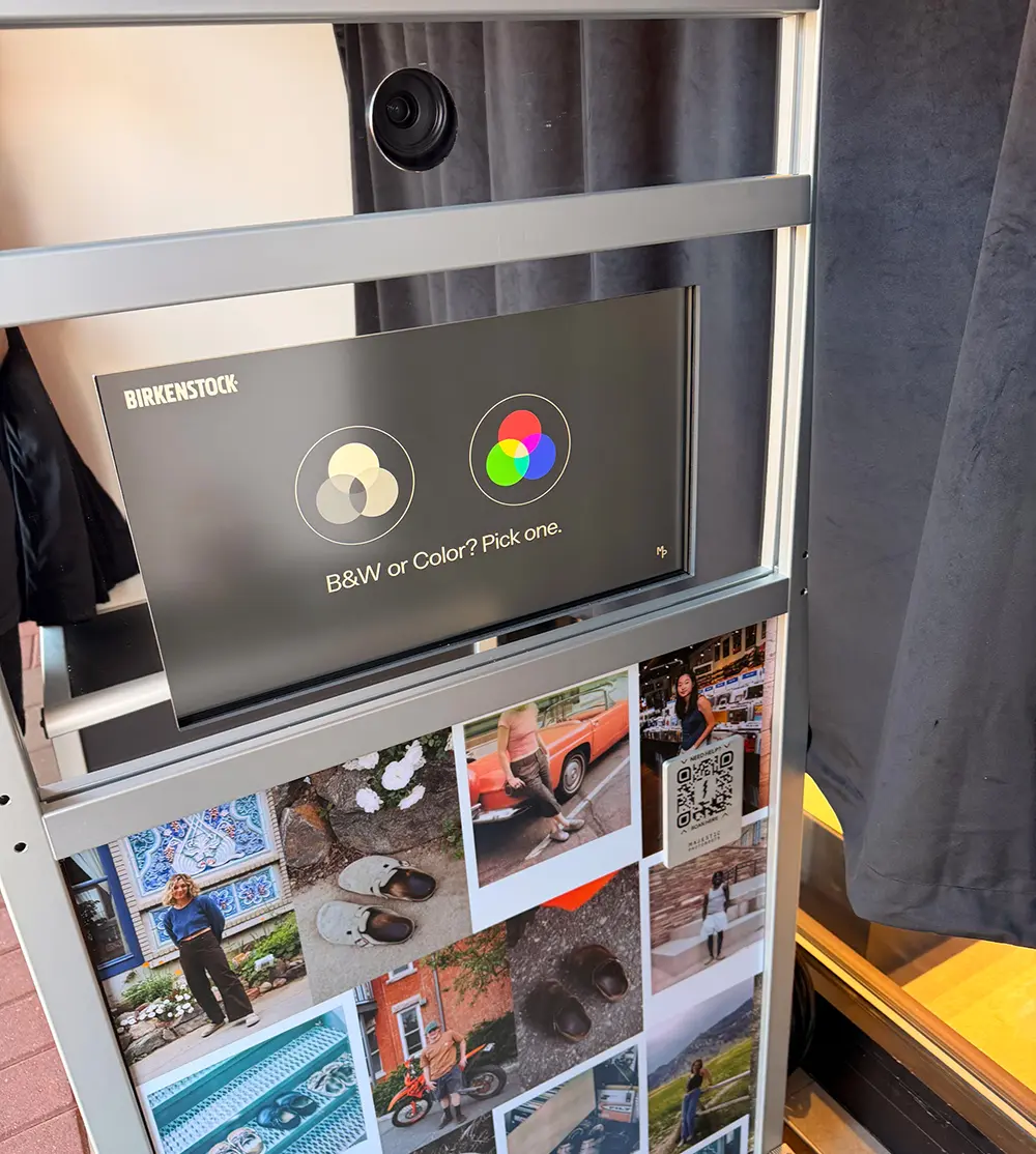 Birkenstock branded photo booth screen showing the black and white or colour choice, with the lifestyle photo collage wrap below