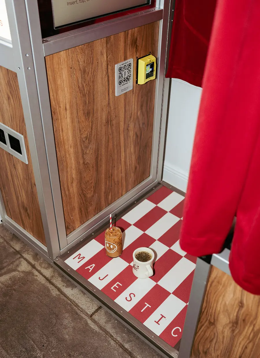 ice coffee and hot coffee inside of a photo booth