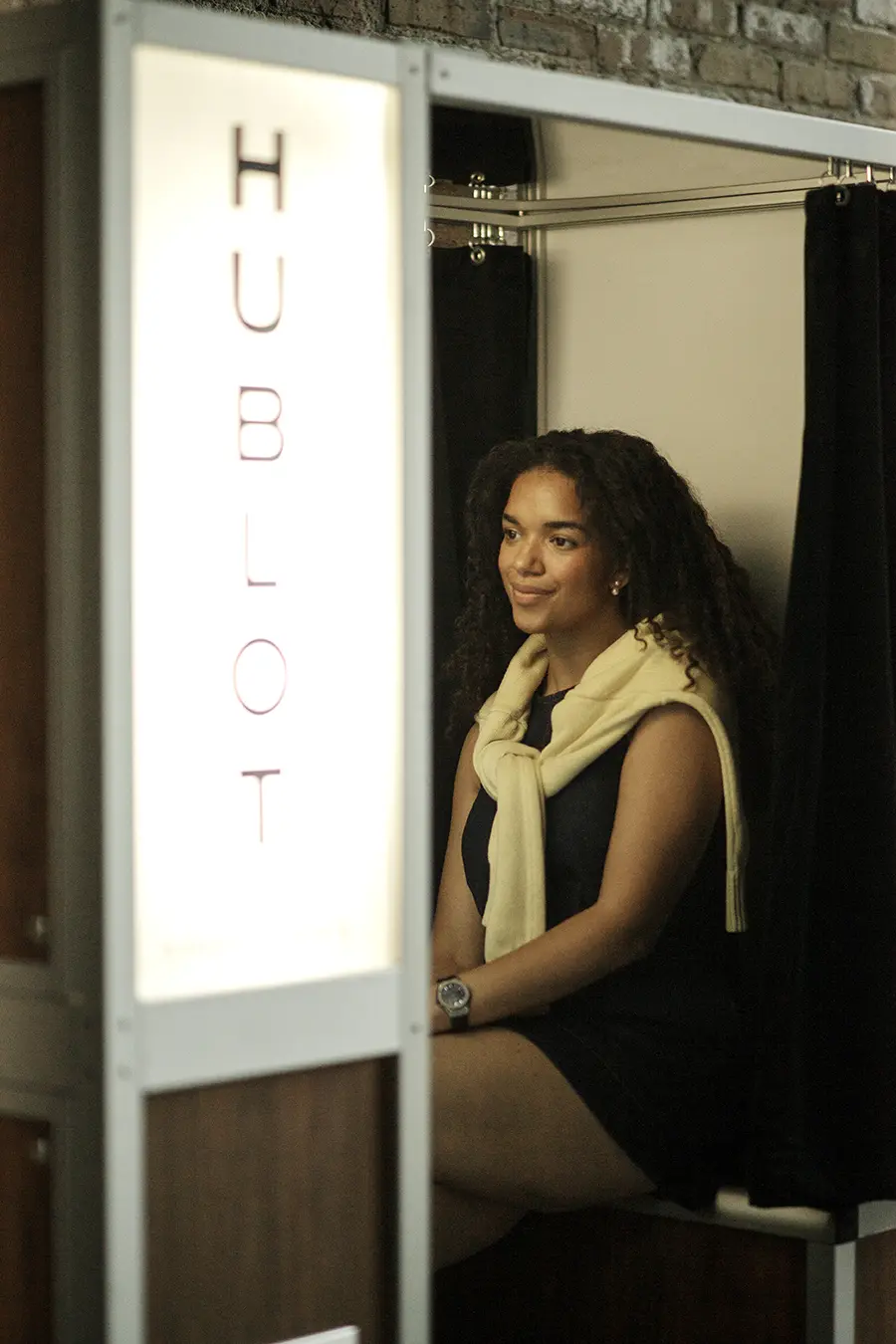 A guest seated inside the Hublot photo booth at the Chicago grand opening