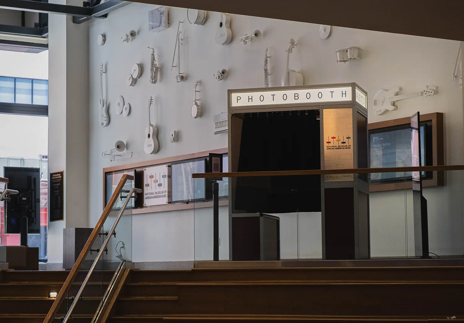 The photo booth on the landing in front of the white instrument wall at the National Museum of African American Music