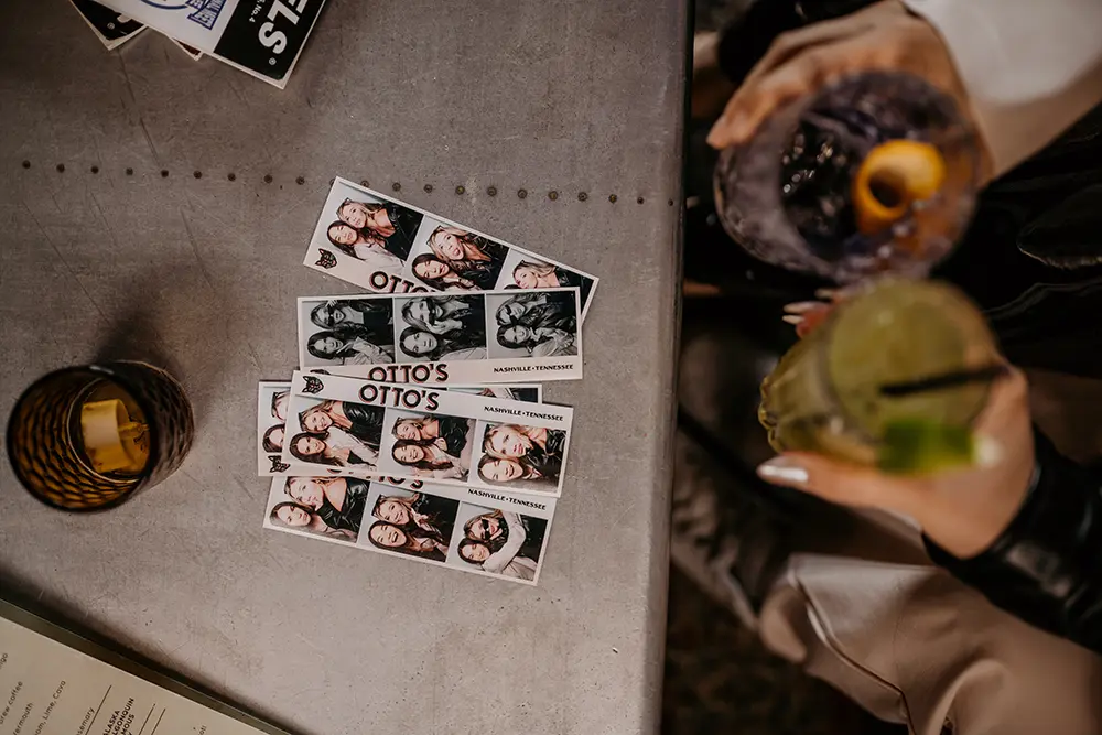 multiple photo booth strip on the table