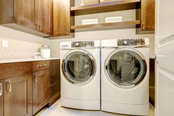 Modern washer dryer with an open drum in a contemporary utility room
          loading=