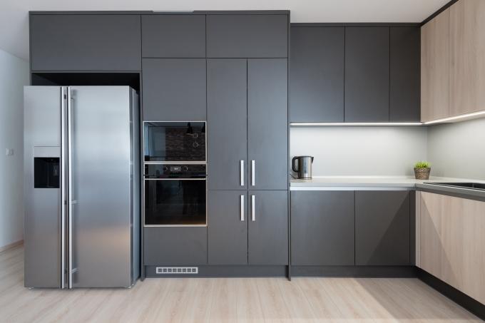 Modern fridge in a kitchen, available from NEA Appliances in Bristol