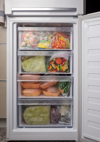 Open upright freezer with multiple drawers for organised frozen food storage