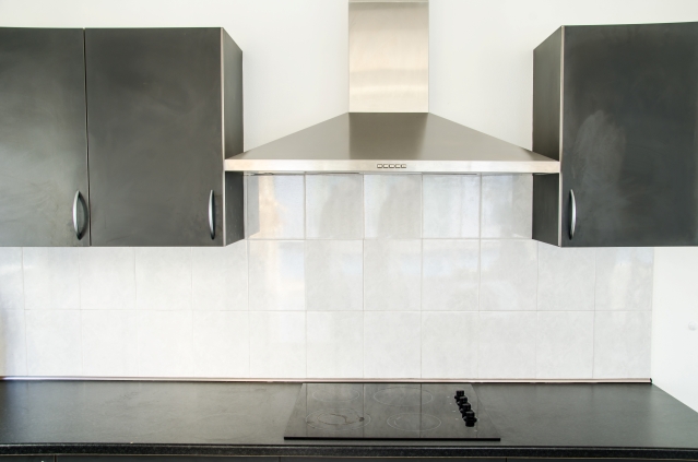 Contemporary kitchen featuring a cooker hood extractor above the cooking hob
