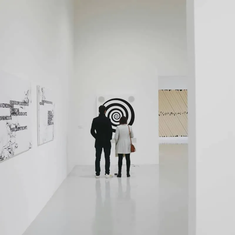 People in front of a painting