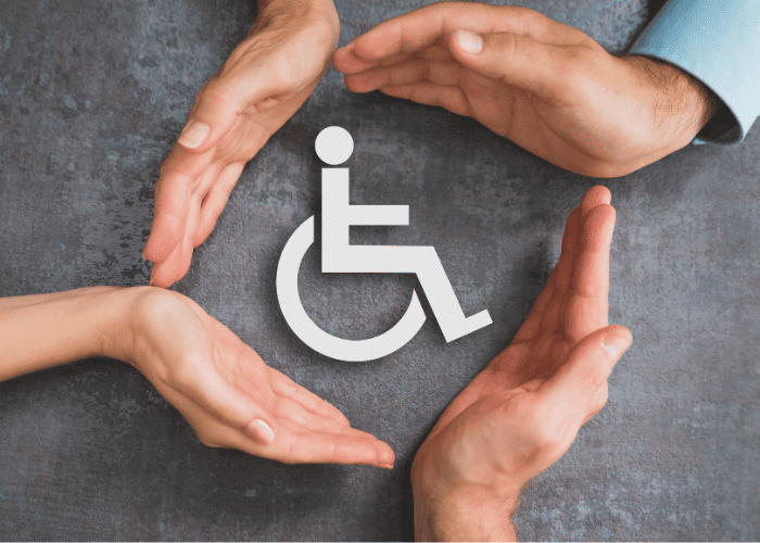 Hands surrounding a disability logo