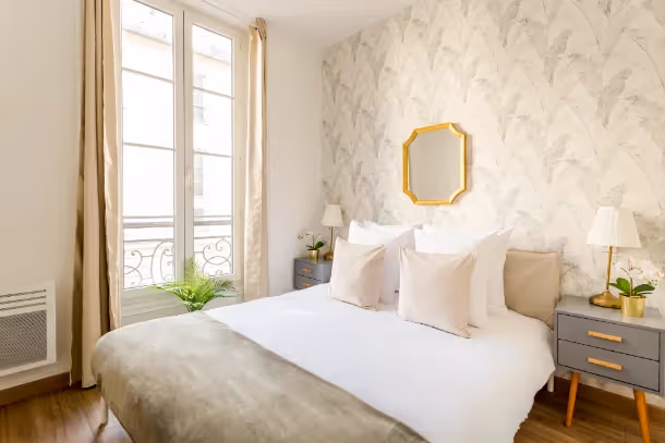 La chambre du Cozy Apartment Caumartin I