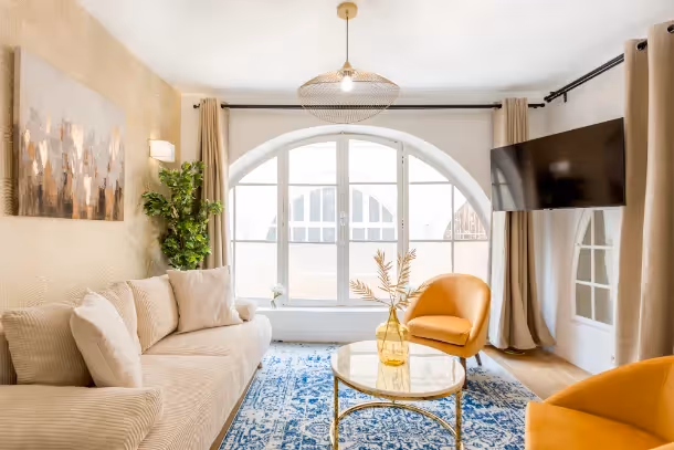 Le salon avec télé Cozy Apartment Dalayrac