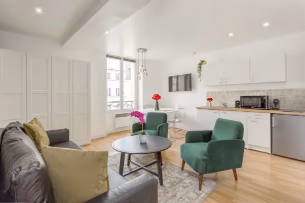 Le salon vue cuisine Cozy Apartment Saint Martin VI