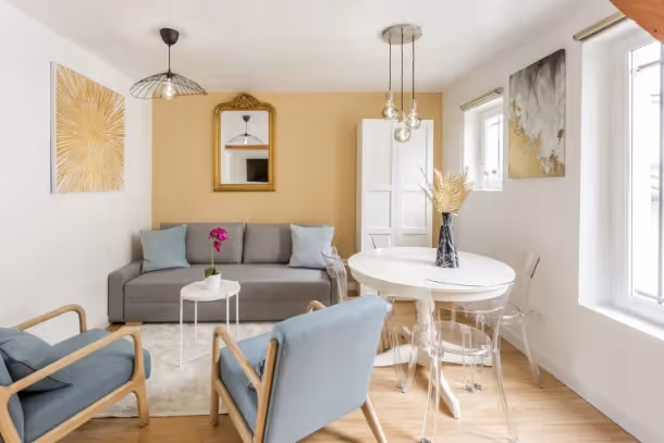 Le salon canapé gris Cozy Apartment Saint Martin V