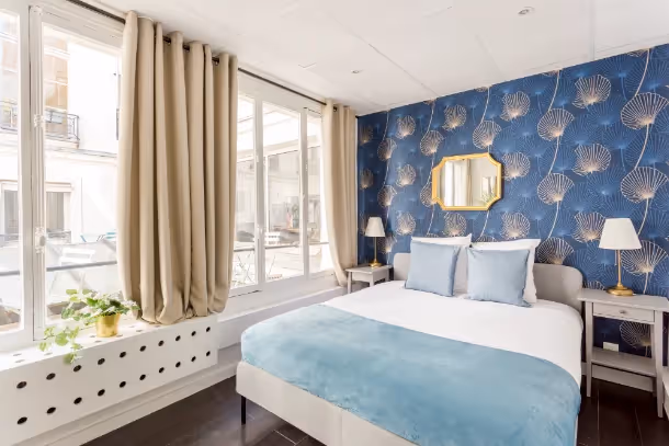 La chambre lit double Cozy Apartment ND des Victoires