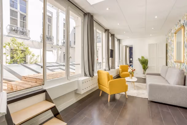 Le salon Cozy Apartment ND des Victoires