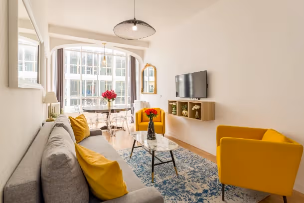 Le salon avec télé Cozy Apartment Sentier II