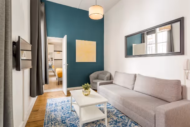 Le salon beige Cozy Apartment Clery