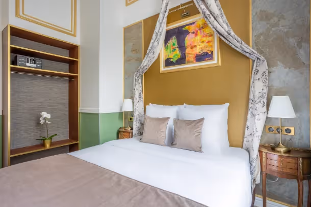 La chambre lit double Luxury Suite Saint Louis