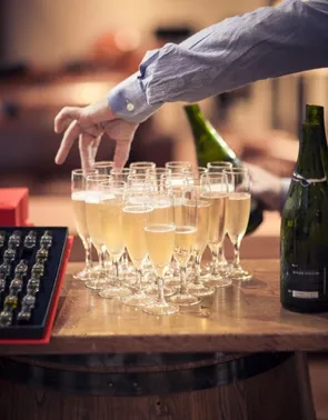 Waiter organizing champagne glasses