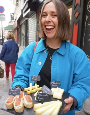 Woman carrying a cheese board