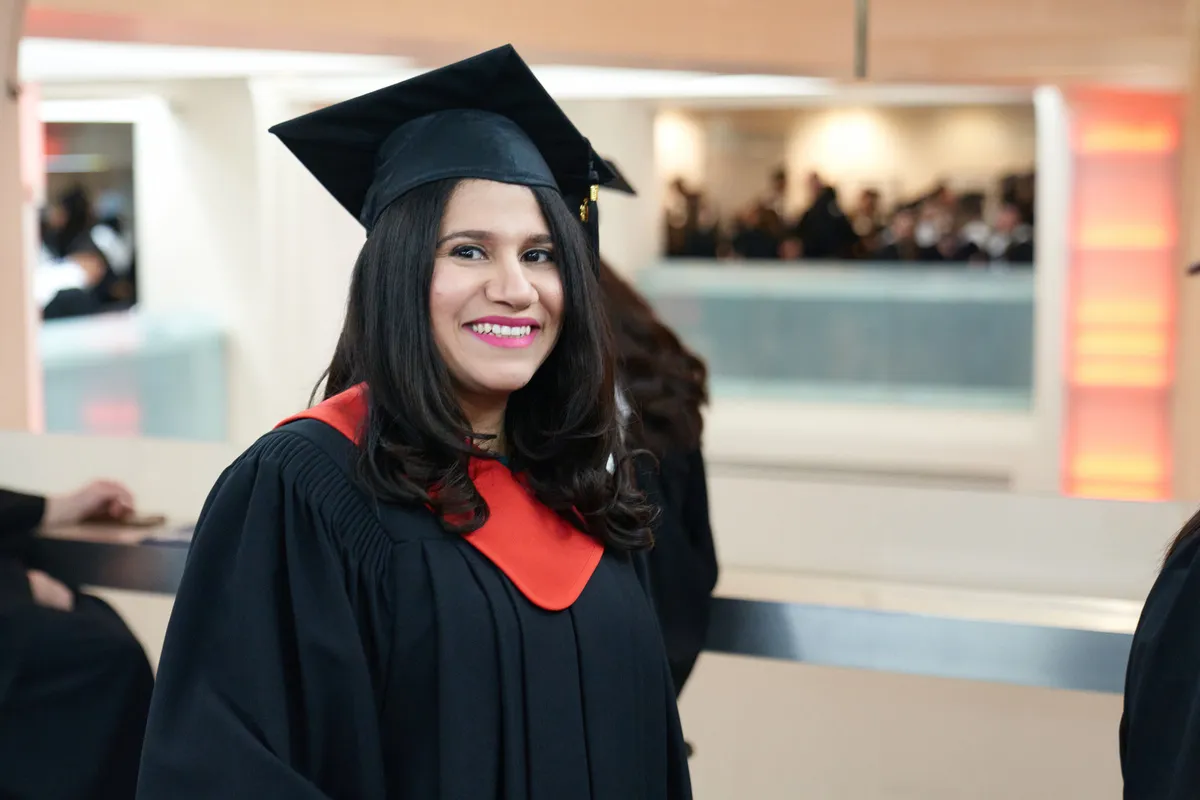 A female Bow Valley College graduate dressed in the convocation regalia