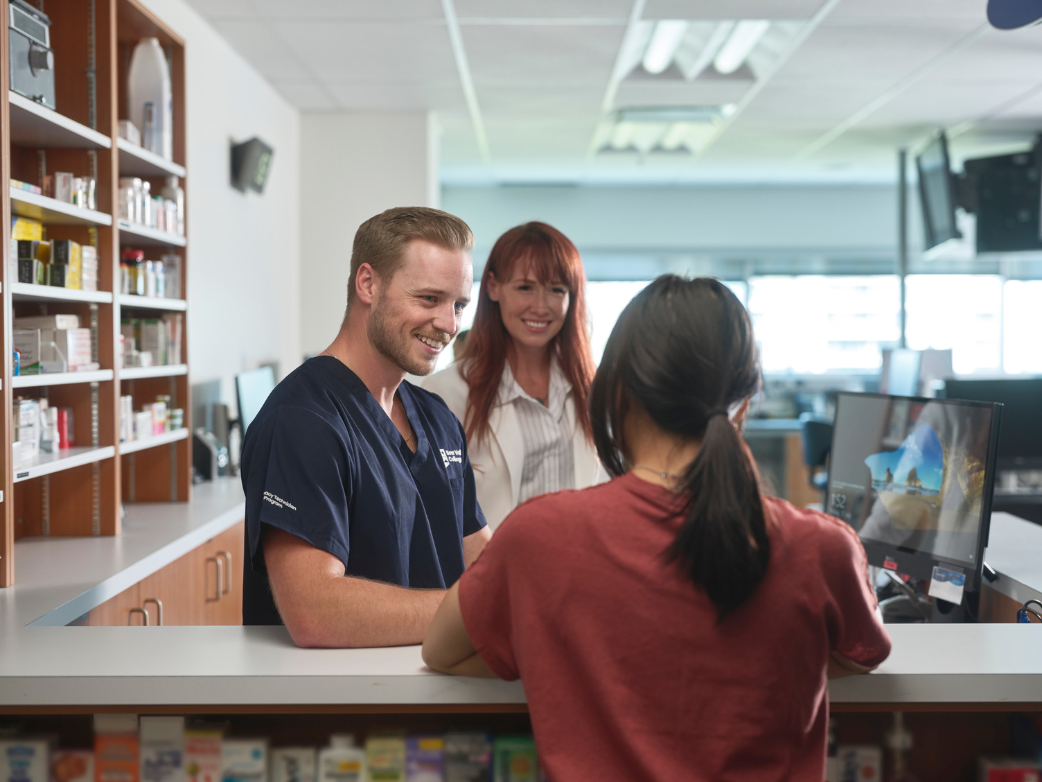 Pharmacy Technician students working at the pharmacy set up at Bow Valley College.