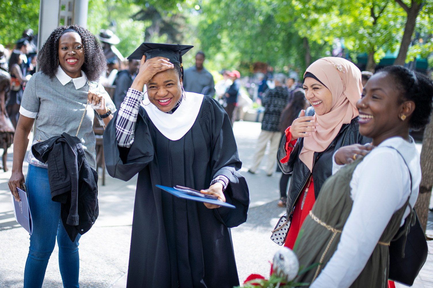 Bow Valley College graduates smile at Werklund Centre