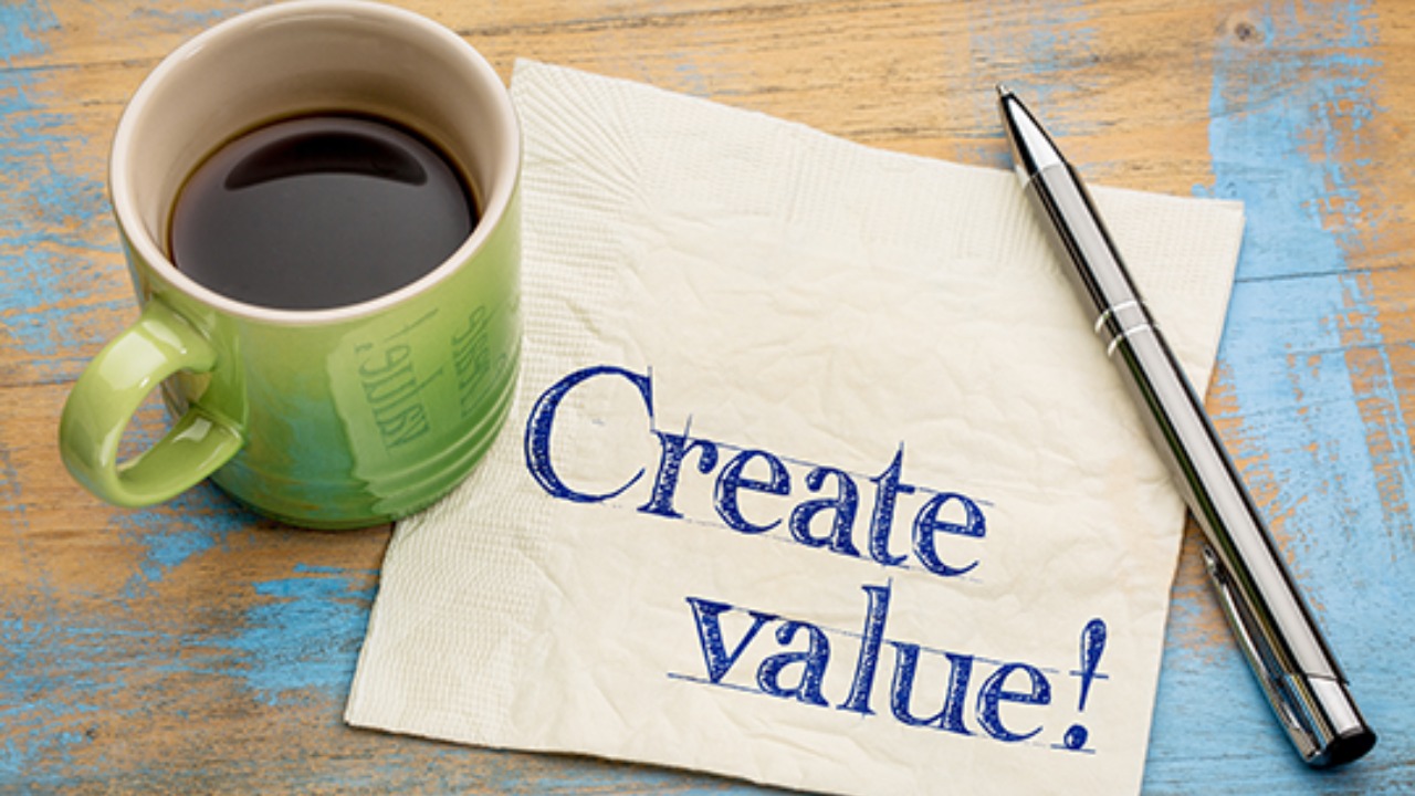 People at a table analyzing a Sell on Amazon Buy Box Chart