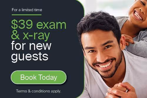 Advertisement for $39 exam and x-ray for new guests with smiling man and woman, and a Book Today button.