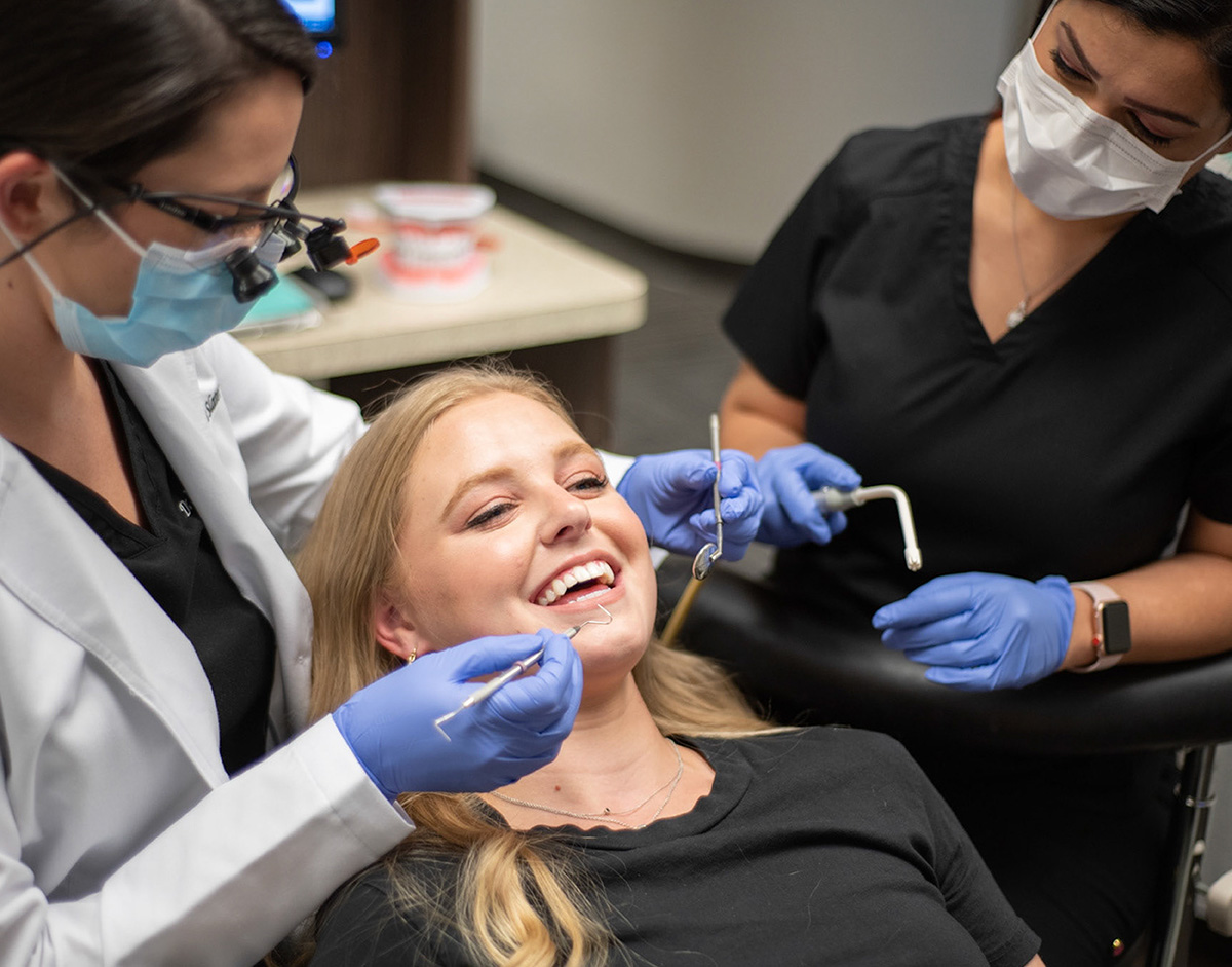 Women undergoing an dental exam at Ideal Dental
