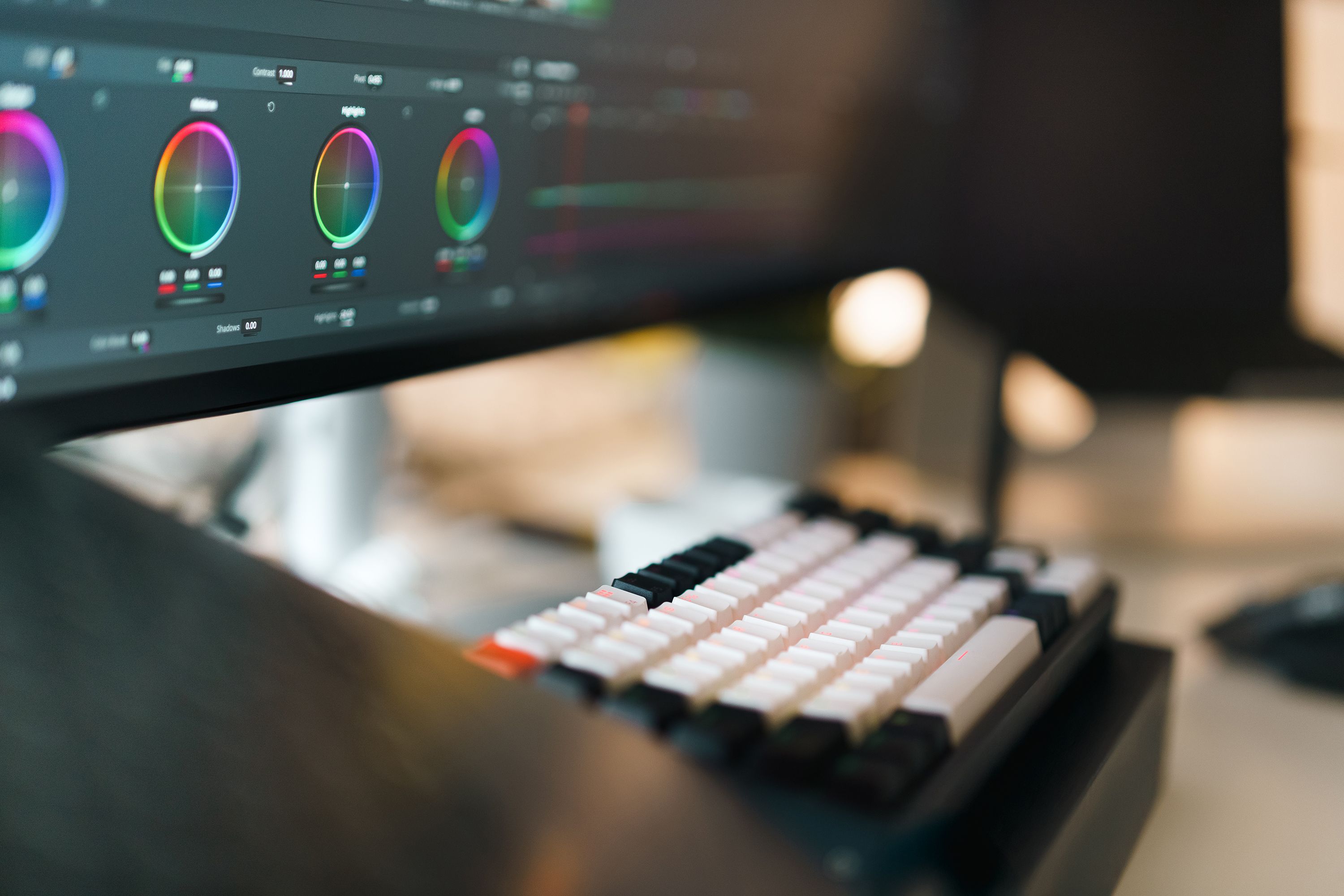 A video editing workspace with an editing keyboard and a timeline on screen
