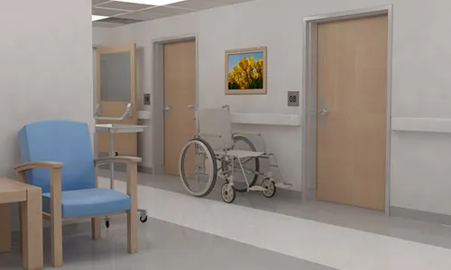 A hospital room with a chair and a table.