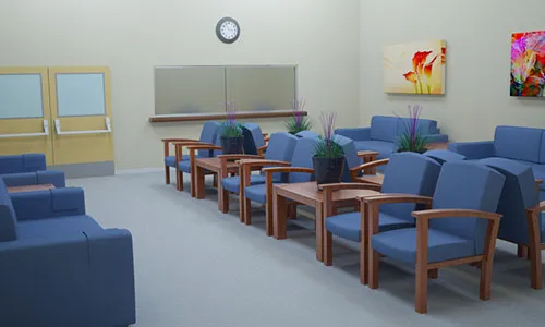 A waiting room with blue chairs and a clock.