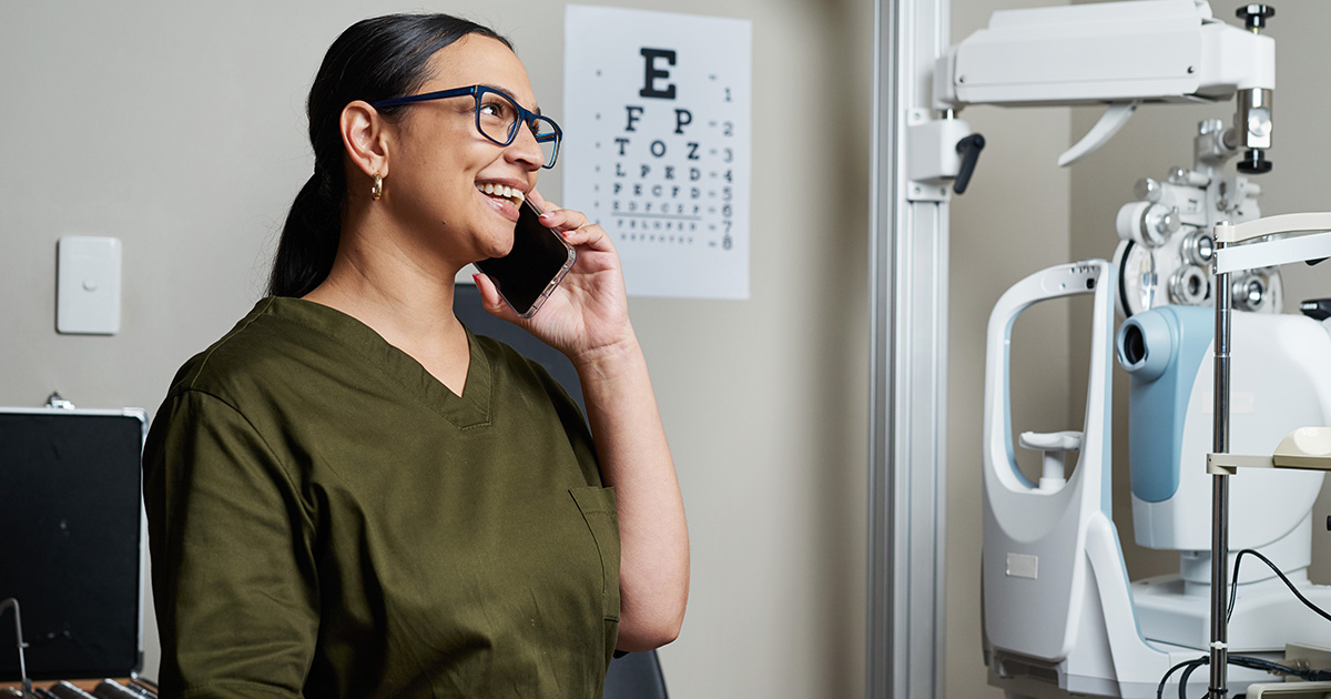 Optometrist holding tablet with eyeglasses display