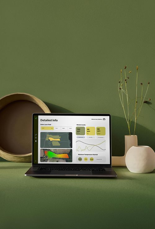 Farm data dashboard shown on a laptop