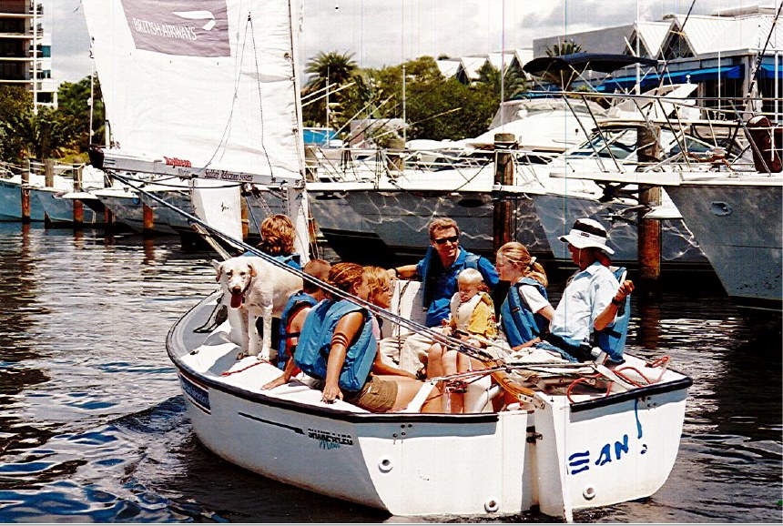 Harry Horgan with a group of program participants aboard a small boat at the dock