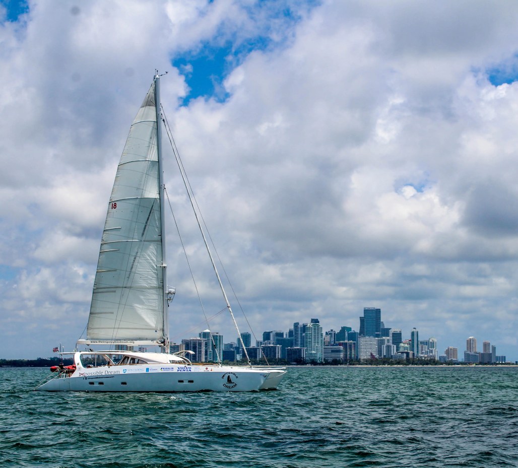 The Impossible Dream, a 60-foot universally designed catamaran, sailing past the Miami skyline