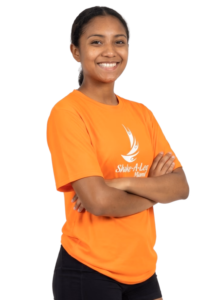 A Shake-A-Leg Miami staff member in an orange program shirt